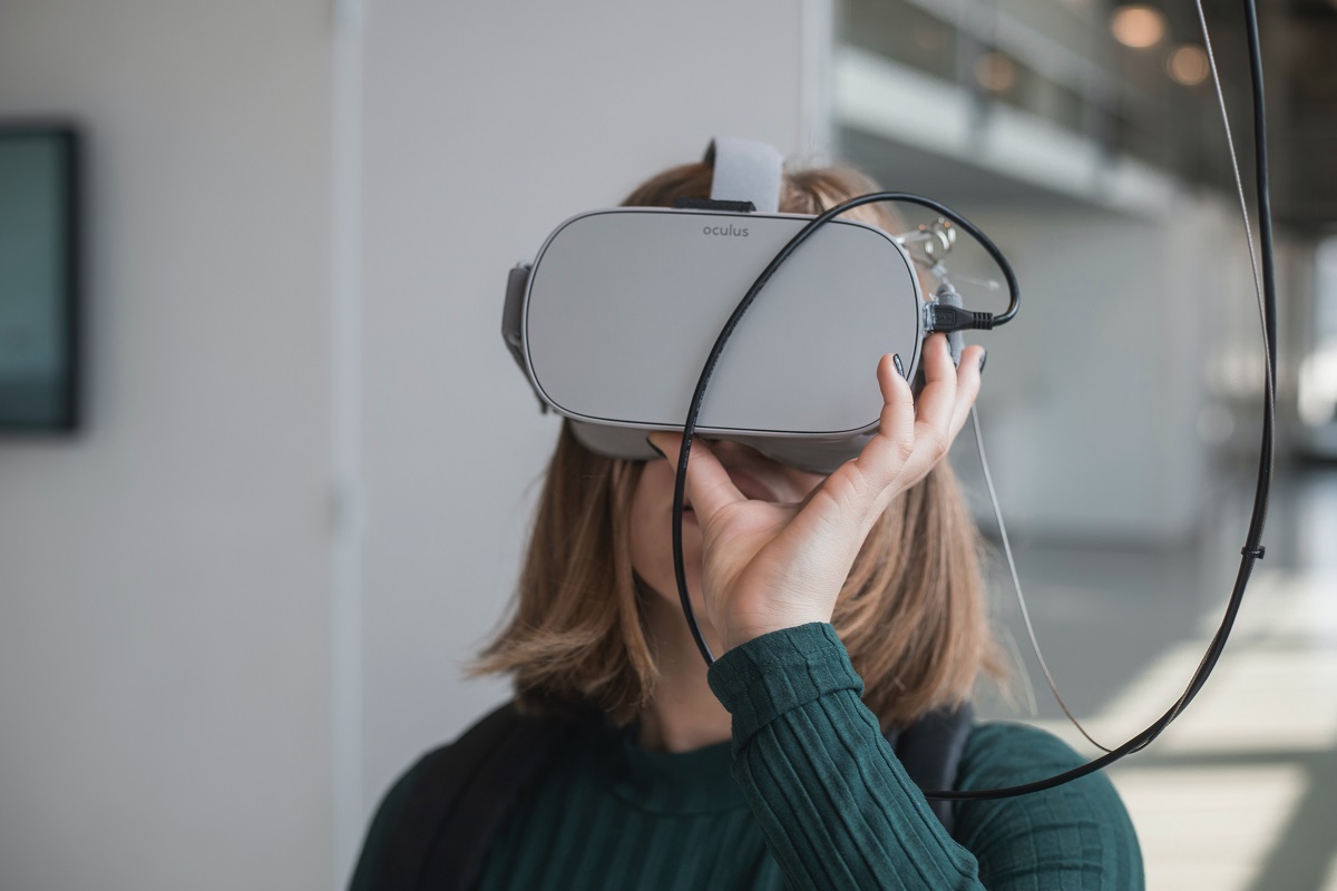 A lady wearing an AI headset as part of University Research